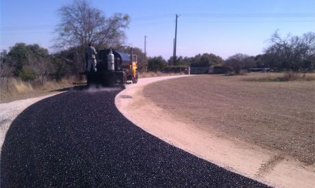 Worker operating equipment for asphalt construction