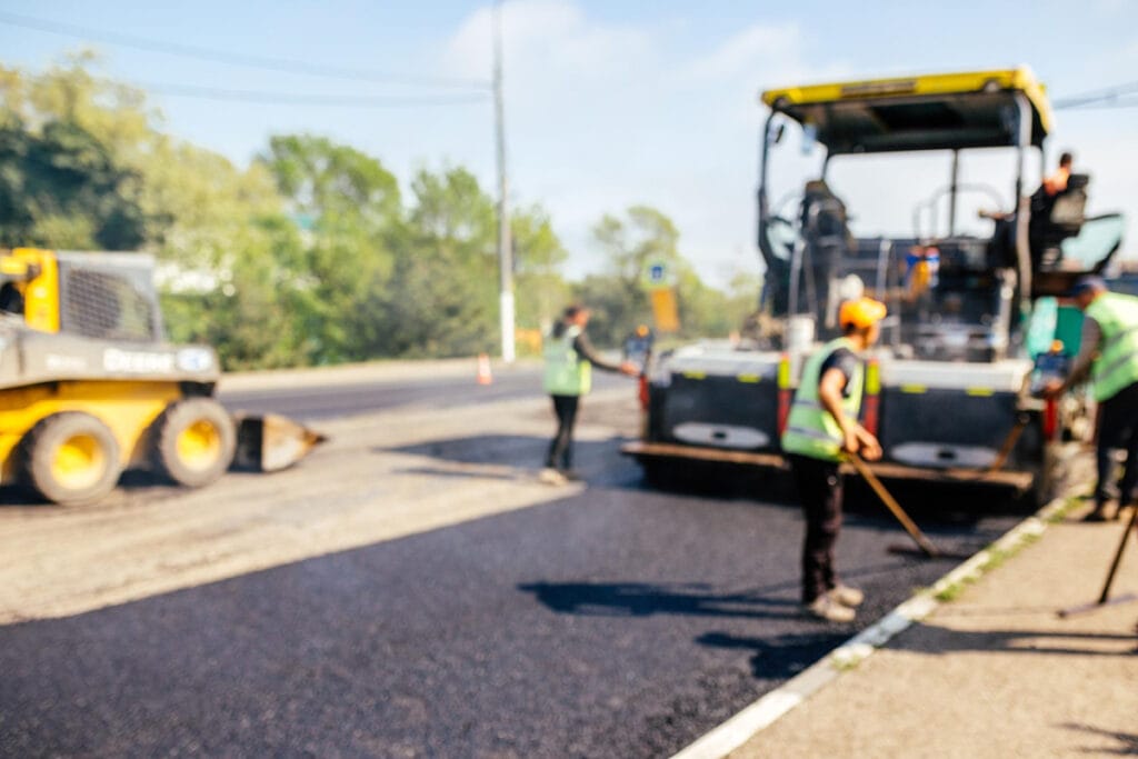 Contact 72 road construction crew used shovels scatter more asphalt top new pavement 2